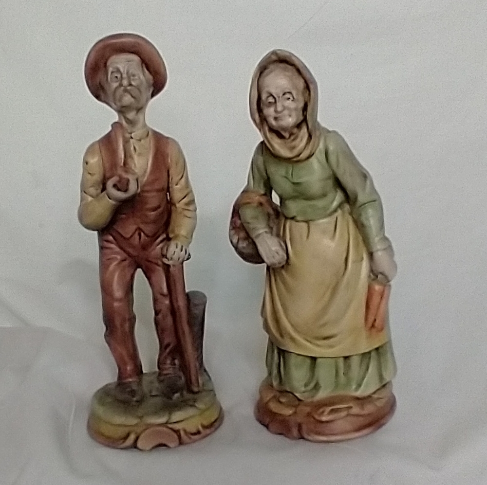Pair of old man and woman figurines